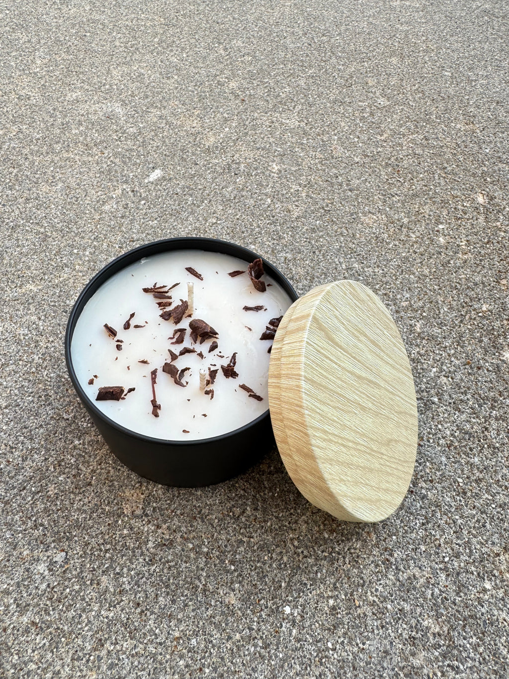 Hand-poured Bees and Botany candle with warm scent notes and soft neutral aesthetic