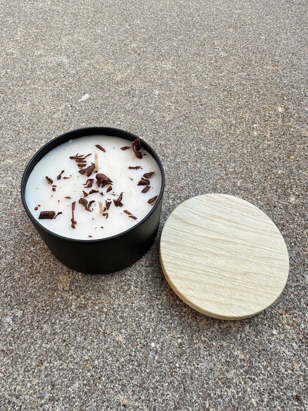 Hand-poured Bees and Botany candle with warm scent notes and soft neutral aesthetic