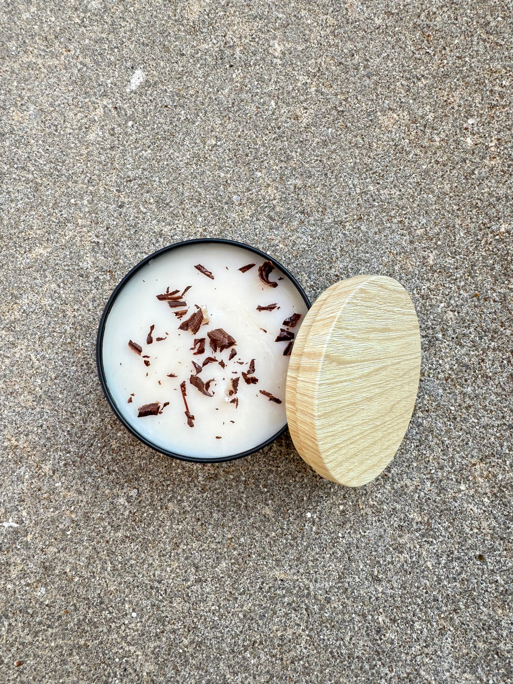 Hand-poured Bees and Botany candle with warm scent notes and soft neutral aesthetic