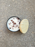 Hand-poured Bees and Botany candle with warm scent notes and soft neutral aesthetic